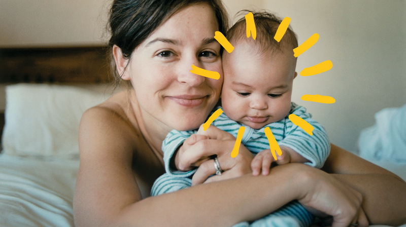 Mom holding cute baby sunshine 