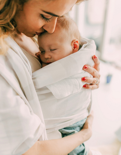 mom holding her baby close 